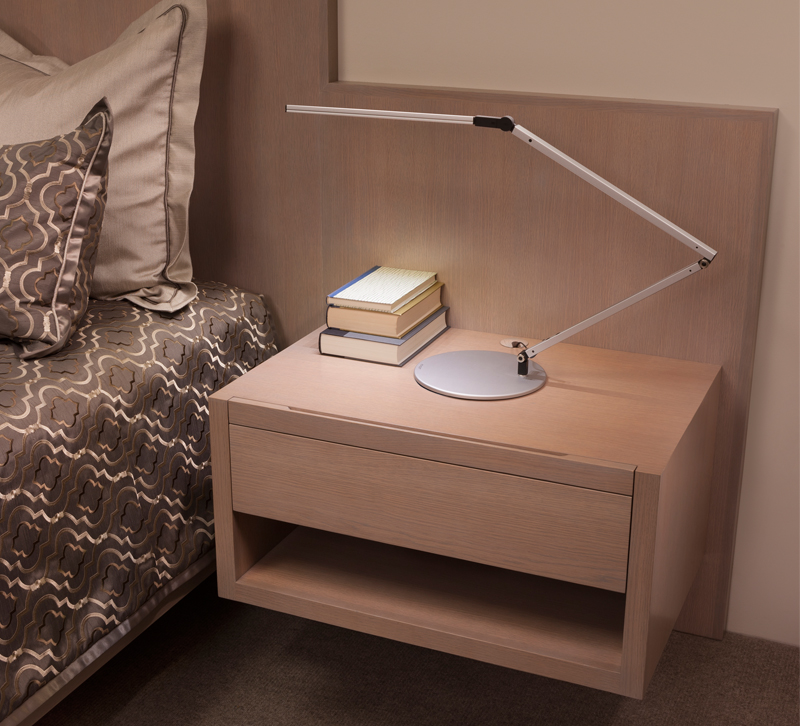Thin LED bedside table lamp in bedroom