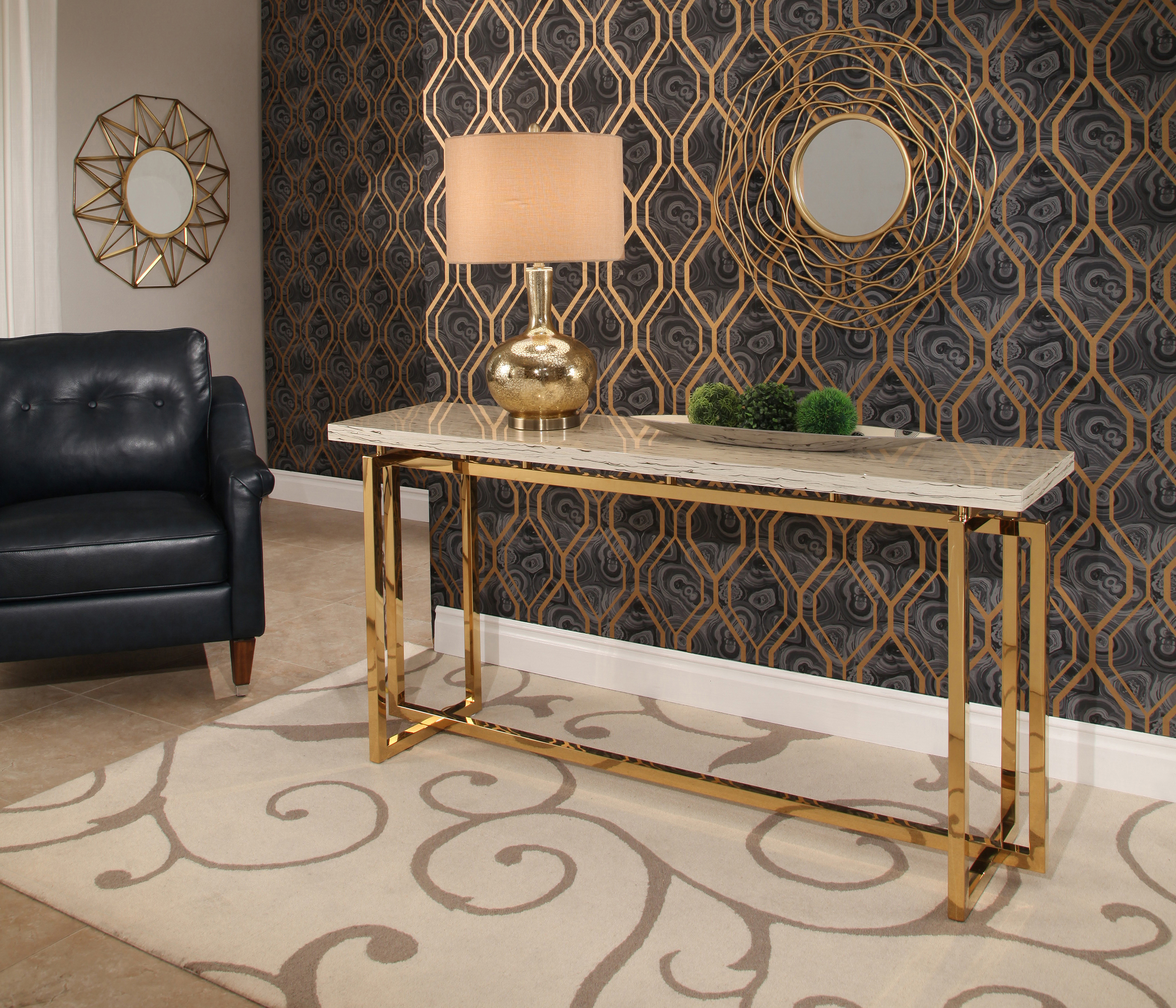 Archer stainless steel sofa table with gold legs and a fiberboard top from Abbyson Living