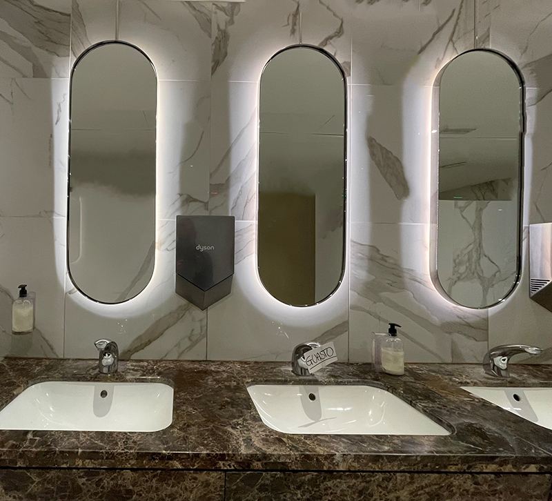 back lit mirrors in a restroom, Randall Whitehead