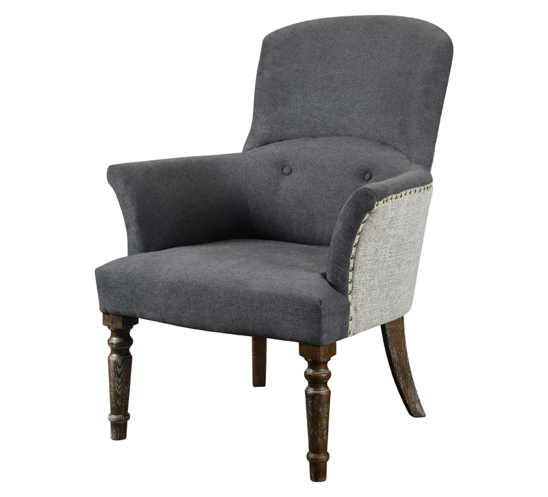 Elle gray upholstered chair with brown legs and a nailhead trim from Forty West