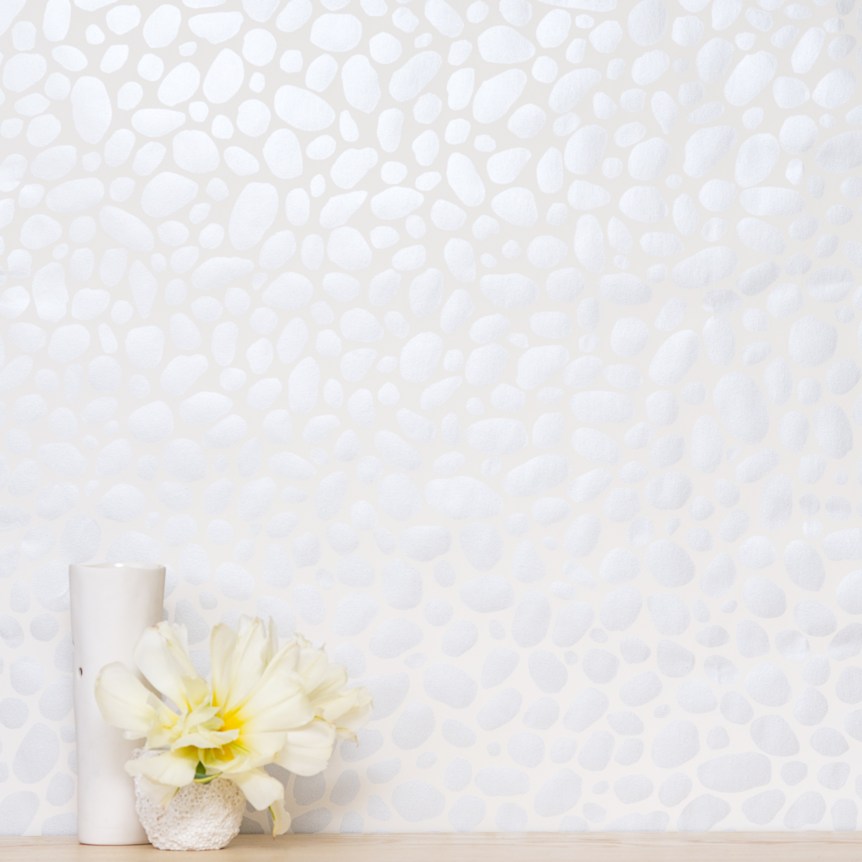 Hoya wallpaper with silver on a cream backdrop from Juju