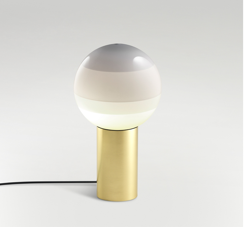 Dipping light with gray rounded orb and brass base from Marset