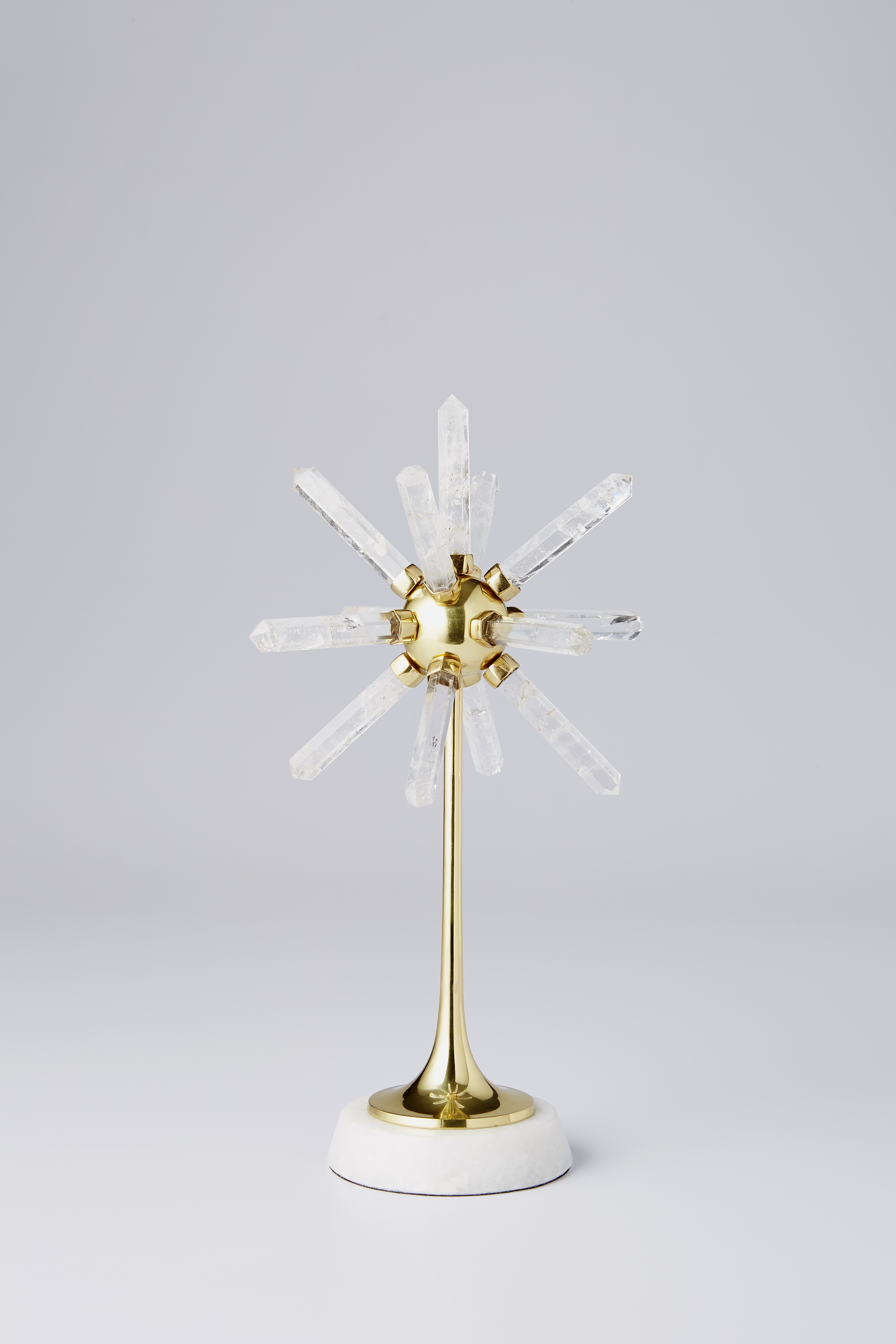 Quartz Star sculpture with a marble base and gold finish from Handley Drive
