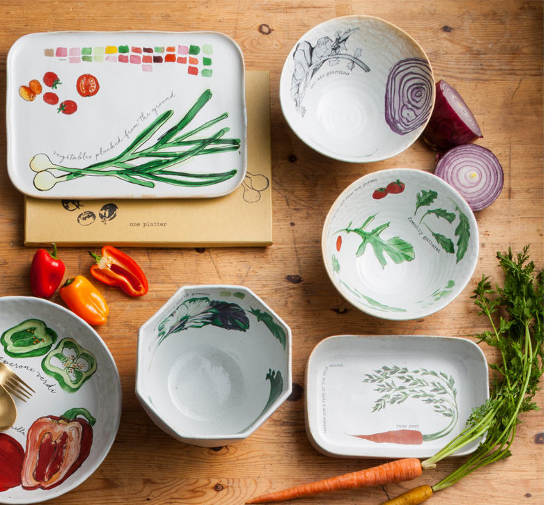 Plates and bowls with vegetables printed on them from Rosanna