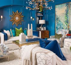 Inside IBB Fine Furnishings' showroom with blue walls and beige sofas and chairs