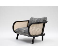 BuzziCane Chair with cane sides and gray fabric from BuzziSpace