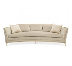 Bend the Rules sofa in a crescent shape with a wood base in Soft Silver Leaf from Caracole