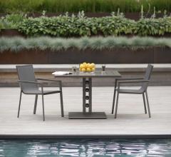 Artemis table gray table and chairs by the pool from Janus et Cie