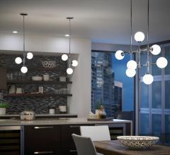 Aura pendants hanging in urban kitchen and above dining room table, pendants from Kichler Lighting