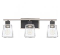Tux three-light vanity light with glass surrounding the three bulbs and black accents on the metal from Capital lighting Fixture Co.