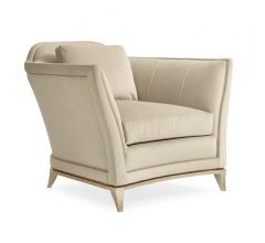 Bend the Rules Chair with beige upholstery and flared arms from Caracole