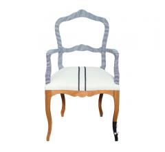 Fingerprint Two Stripes Arm Chair with an open back and curvy, brown legs from Bunakara