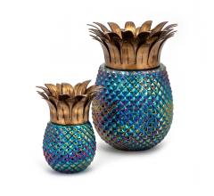 Waipio Small and Large pineapple-shaped Hurricanes with a blue iridescent bottom and gold top from IMAX Worldwide Home