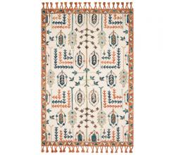 Kasuri Ivory/Persimmon Area Rug with an orange border and tassels from Loloi Rugs