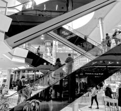 Shopping mall escalators in black and white