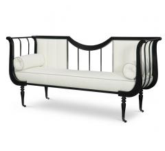 Lyre Bench with a black frame, white fabric and wheels on all four legs from Fine Furniture Design