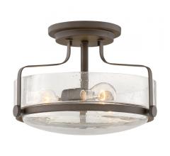 Harper Flush Mount in Oil-Rubbed Bronze with seeded glass surrounding two Edison bulbs from Hinkley Lighting