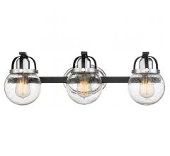 Piermont three-light Bath Light with seeded glass surrounding three Edison bulbs from Quoizel