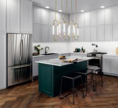 Kitchen with white cabinets and a gold linear pendant