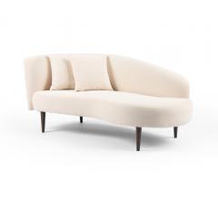 Luna Chaise in an ivory boucle fabric and brown tapered legs from Four Hands