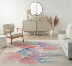 Nourison’s Prismatic in Ivory offers vibrant strokes of purple, blue, pink and gold.