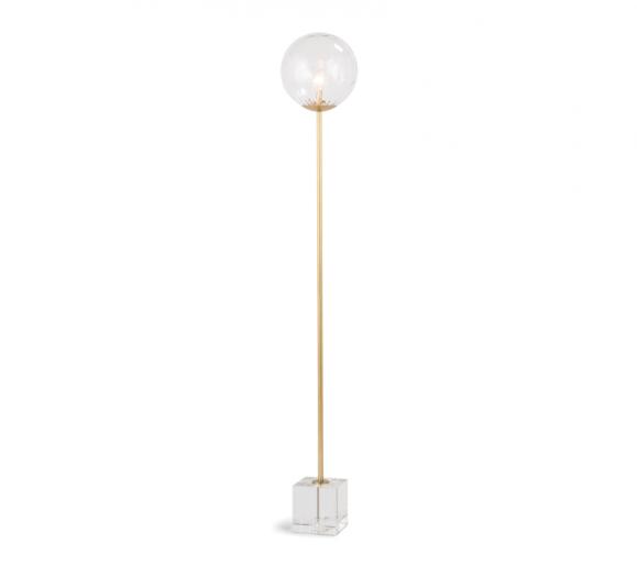 Rio floor lamp with one single brass rod and glass orb on top standing on an acrylic base from Regina Andrew Design