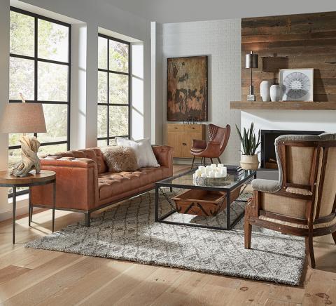 The Sarreid Cuba Brown Leather Cube X 3 Sofa features tufting on the seat, inside back and arms.
