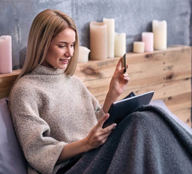 woman-sitting-on-couch-online-shopping