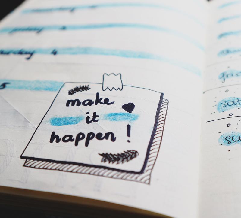 High Point Market book planner with Make It Happen post-it note