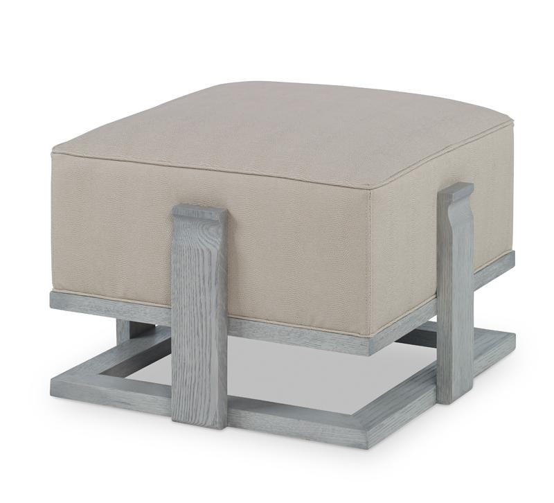 Quadro Bunching Ottoman with a gray wooden base and a beige square cushion from Chaddock Home