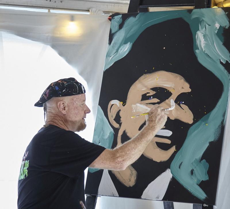 Dale Henry painting a portrait of Frank Sinatra