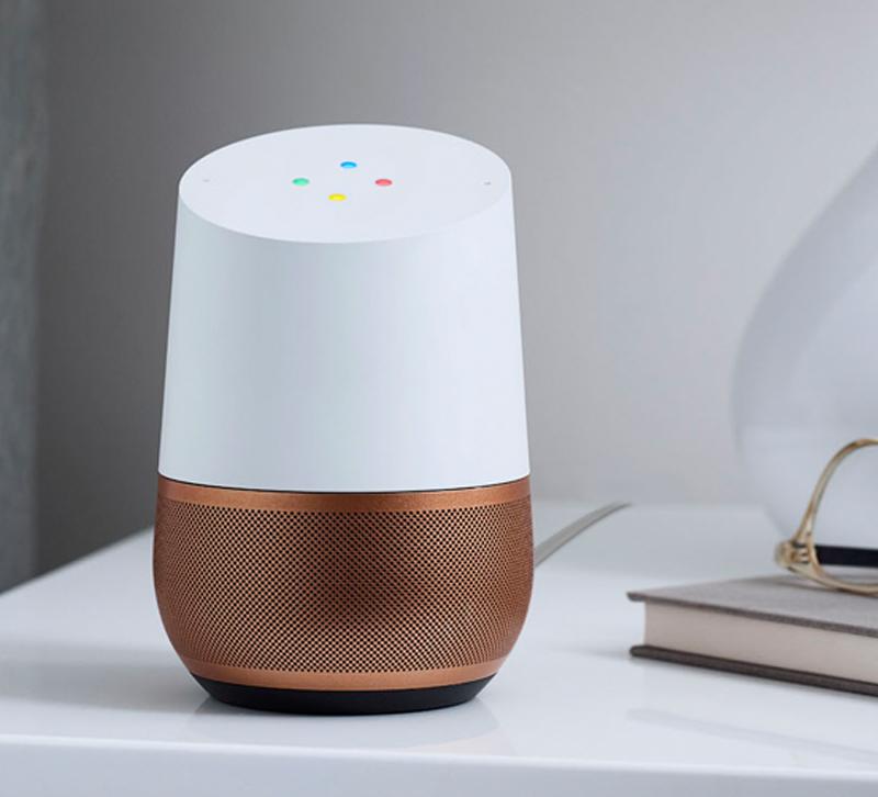 Google Home speaker with copper base sitting on desk