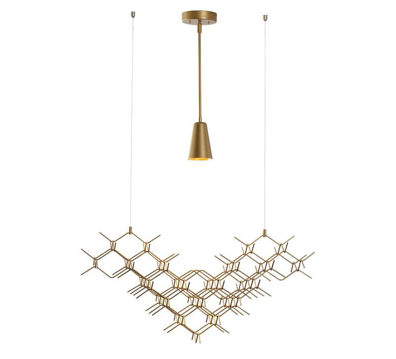 Hive Pendant made of gold finished honeycombs with one LED light above from Vermont Modern