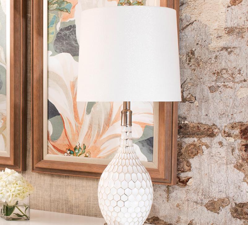 White lamp with shade on table