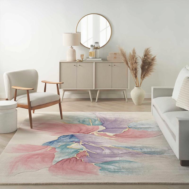 Nourison’s Prismatic in Ivory offers vibrant strokes of purple, blue, pink and gold.