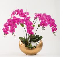 pink orchids in gold scalloped bowl