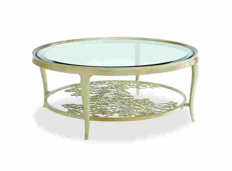Caracole: Measuring 48 inches in diameter, the Handpicked cocktail table features beveled glass, cabriole legs and an Oracle Silver Leaf finish. The floral metal grille brings the table to life. Bldg. 1, 14-C6. www.caracole.com