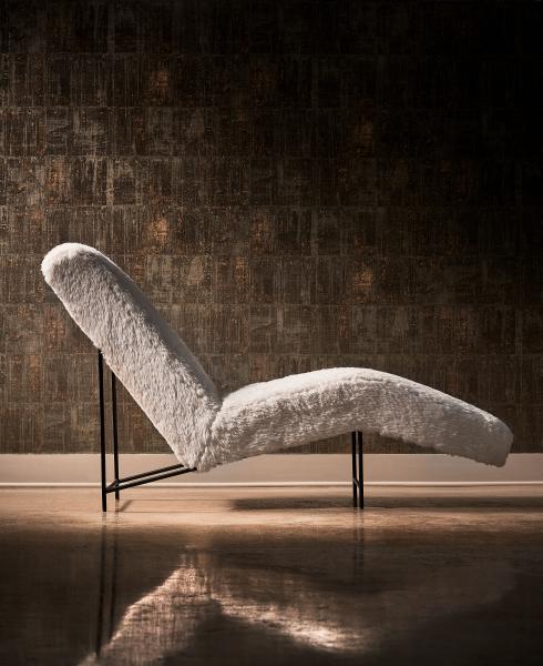 Fully upholstered in nubby faux sheepskin, this chaise with metal legs is new from the Erinn V. collection for Universal. 